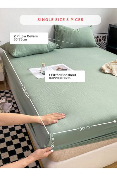 LUNA HOME 3pc Set: single-size fitted bedsheet and two pillowcases, washable cotton in a light green color.
