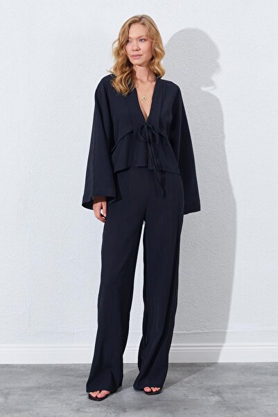 TENA Γυναικεία μαύρη φαρδιά μπλούζα με βολάν μπροστά και φαρδιά μανίκια