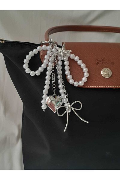 bijoux uniques حقيبة ساحرة على شكل فيونكة وقلب ونجمة بحر