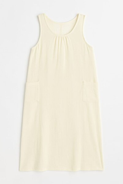 enmodaiçgiyim Κρεμ 100% βαμβακερό ύφασμα μουσελίνας μακρύ γυναικείο φόρεμα με τσέπες – καλοκαιρινό άνετο και μοντέρνο μοντέλο