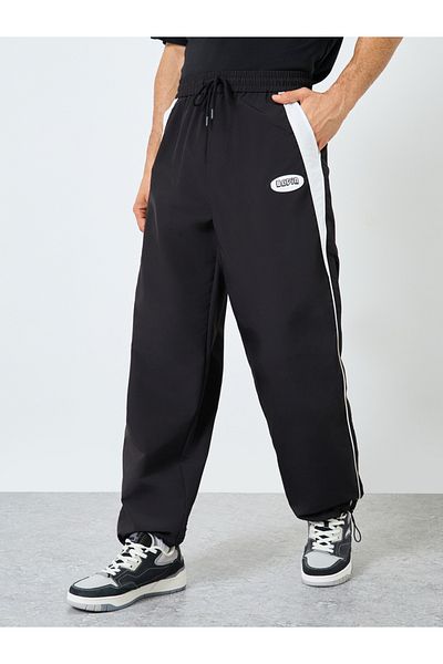 Styli Black Relaxed Fit Joggers with Side Piping and Placement Print