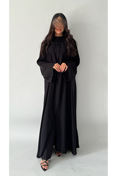 outline Black quarter-cloche abaya set with black embroidery and an inner dress under the abaya
