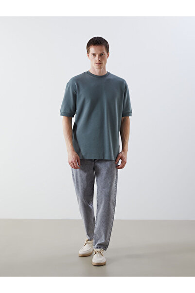 LC Waikiki بنطلون جينز رجالي فضفاض من أوزماركا للموسم الجديد