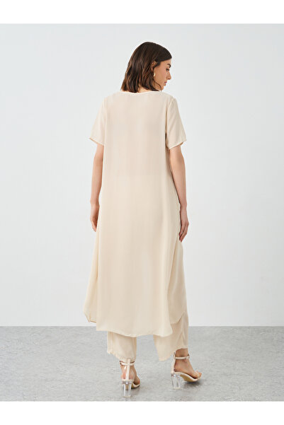 Styli Women Beige Solid Asymmetric Hem Tunic and Pants Co-Ords