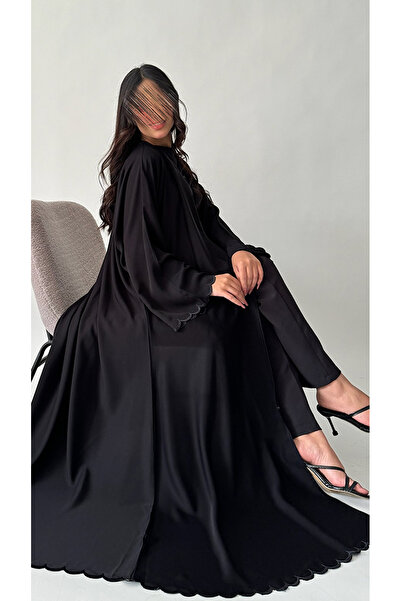 outline Black quarter-cloche abaya set with black embroidery and an inner dress under the abaya