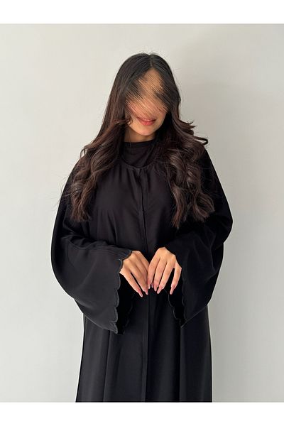 outline Black quarter-cloche abaya set with black embroidery and an inner dress under the abaya