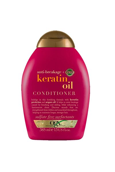 OGX بلسم للعناية بالشعر بزيت الكيراتين مضاد للتكسر من او جي اكس