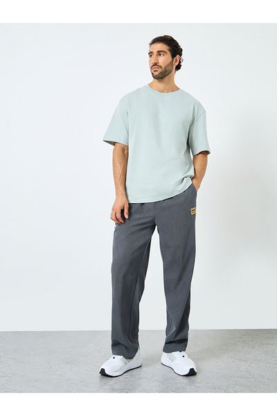 Styli Relaxed Fit Open Hem Joggers with Badge Detail and Contrast Drawcord