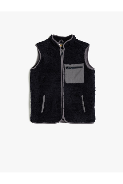 Koton سترة من الفرو الصناعي باللون الأزرق البحري للأولاد