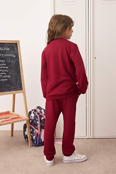 TRENDYOLKIDS Bordó pamut szlogennel nyomott lányok kötött pulóver és melegítőnadrág alsó-felső szett TKDAW25AU00038