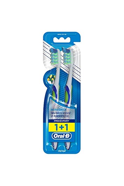 Oral-B فرشاة أسنان يدوية متوسطة الحجم من برو-إكسبيرت إكسترا كلين، بشعيرات مائ...