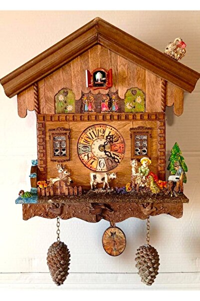 Genel Markalar Guguklu Duvar Saati Kuş saat başı çıkar öter kanat çırpar. Ahşap el yapımı 35/45/10 cm.
