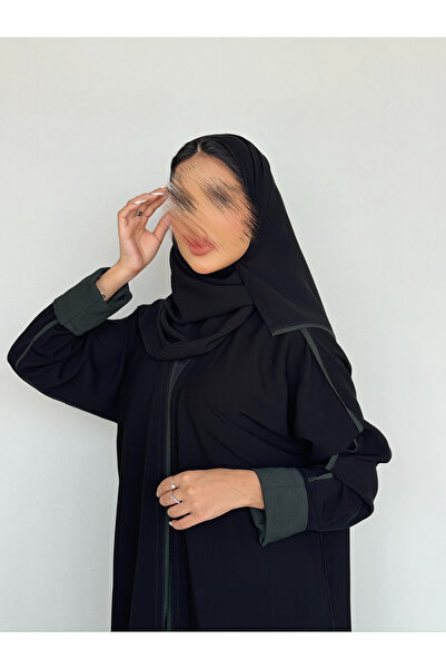 outline Black daily abaya with Arabian Nights fabric and olive green hem