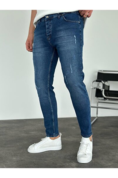 KağanKY جينز ضيق بتفاصيل ليزر باللون الأزرق الداكن