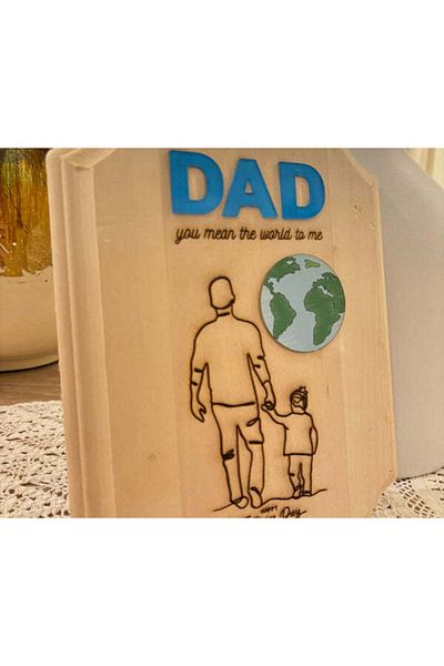Reventon Engraved elegant wood piece with cutouts of world map and DAD ward