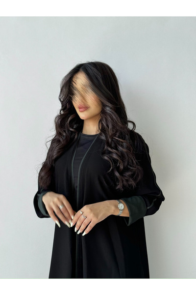 outline Black daily abaya with Arabian Nights fabric and olive green hem