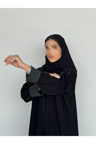 outline Black daily abaya with Arabian Nights fabric and olive green hem