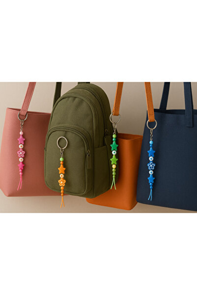 MODA MANANI مجموعة من 4 سلاسل مفاتيح ملونة على شكل نجمة وزهرة