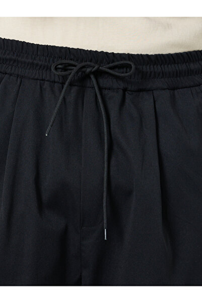 Styli Solid Oversized Pleated Trousers with Drawstring
