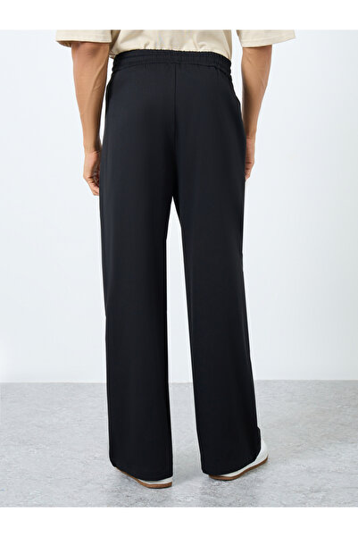 Styli Solid Oversized Pleated Trousers with Drawstring