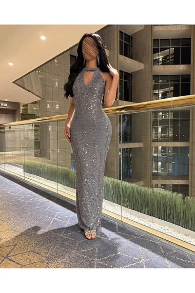 Afnan Boutique Mermaid-style evening dress in a shiny gray color.