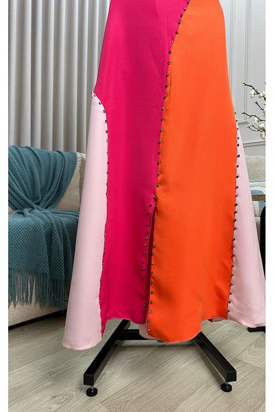 Diva style A distinctive and elegant dress with bright and vivid colors and beaded embroidery.