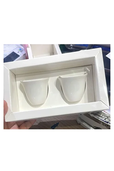 Mini Distribution of a set of Arabic coffee cups with the national logo printed on them.