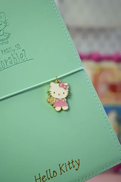 Victoria's Journals Hello Kitty Vegan Leather Daily 13X18 cm Lined Notebook with Elastic – Charm Ornament Detail