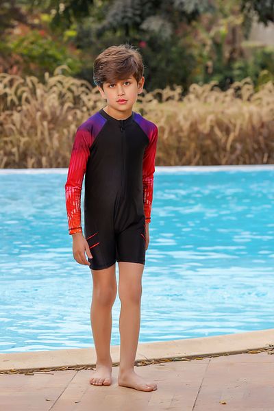 La Mer Boys' swimsuit with a sporty design that covers the body and provides protection and flexibility during movement.