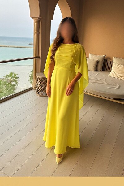 4YOU Soft yellow evening dress with cape sleeves and delicate embroidery