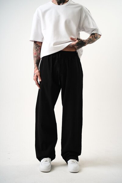 OEM بنطلون من قماش الموسلين من إيسينزا، مصنوع من القطن بنسبة 100%، باللون الأسود