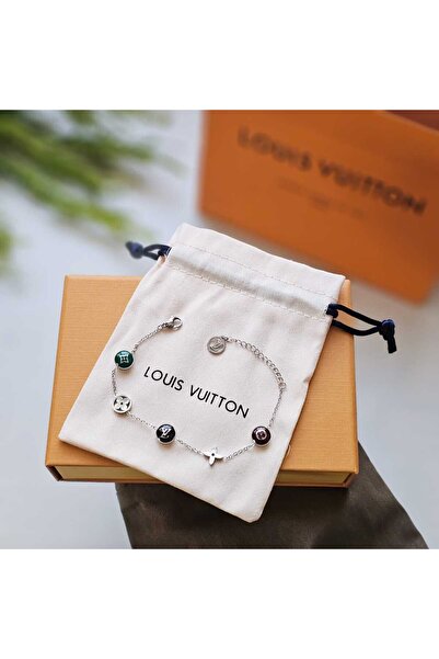 LV Louis Vuitton bracelet with its distinctive shape and accessories