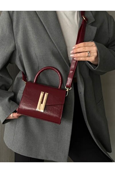 grand coco Women's Burgundy Hand and Shoulder Bag with Gold Buckle Detail