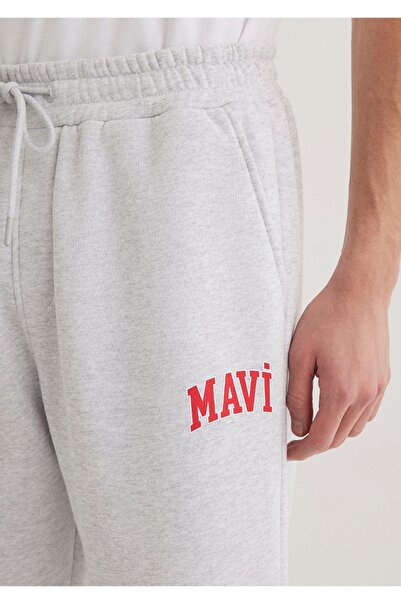 Mavi logo baskılı normal bel loose fit lastikli paça eşofman altı