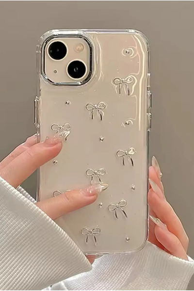 Fibaks Apple iPhone 14 Plus / 15 Plus Case Bow Pattern Transparent Glitter Silver Camera Protruding Shiny