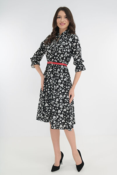 Vanessa Line RO Black dress with animal print and a red belt at the waist