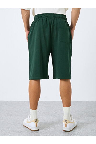 Styli Solid Oversized Shorts with Drawstring
