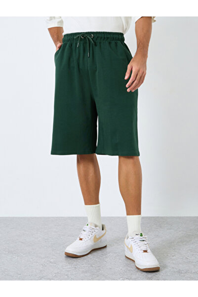 Styli Solid Oversized Shorts with Drawstring