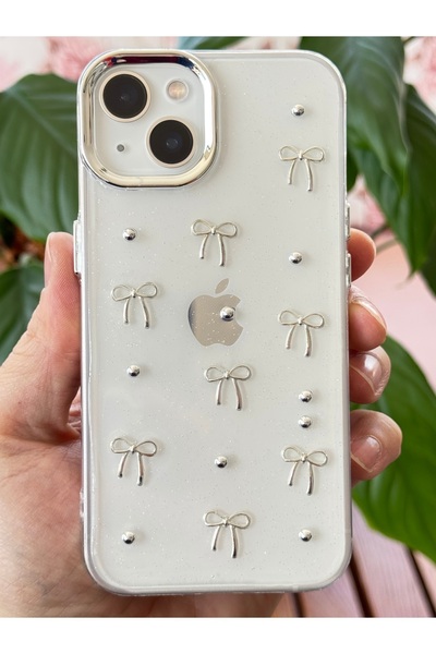 Fibaks Apple iPhone 14 Plus / 15 Plus Case Bow Pattern Transparent Glitter Silver Camera Protruding Shiny