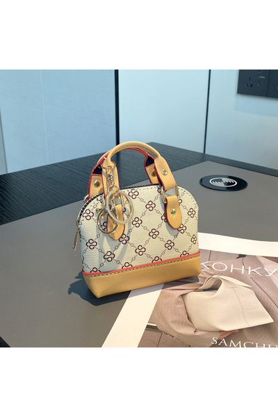 Choice حقيبة صغيرة مطبوعة باللون الأصفر ومزودة بسلسلة قطرية محمولة باليد وحقي...