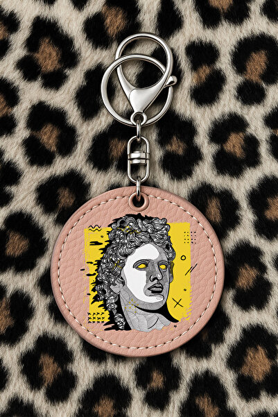 Cekuonline سلسلة مفاتيح جلدية قابلة للتجميع مع نقش مطبوع بتصميم مرح ولون وردي فاتح: تمثال