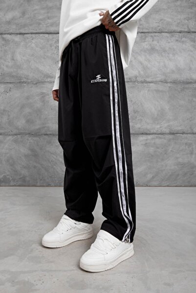 NOMARC Μαύρη φαρδιά αθλητική φόρμα από ύφασμα αλεξίπτωτου με γράμματα Etxoebang