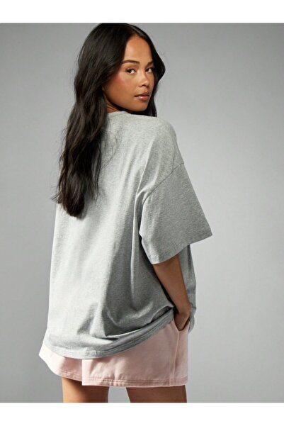 Kaptins Women's T-Shirt with the Message, "I'M Running, I Can'T Write" Printed on It.