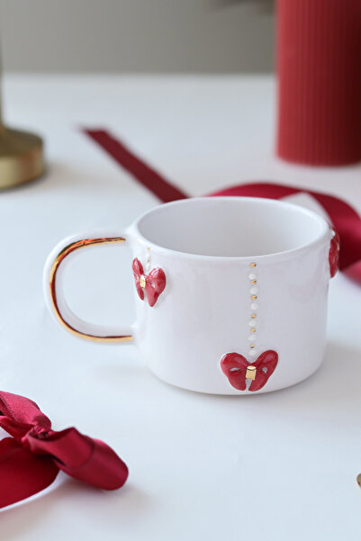 ada mia seramik كوب سيراميك مزين بالذهب عيار 24 قيراط مع تصميم فيونكة مصنوع يدويًا