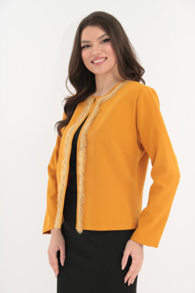 Vanessa Line RO Mustard cardigan accessorized with natural fur