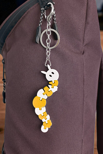 Lusida Design Breloc galben articulat flexibil cu figură de omidă și ornament...