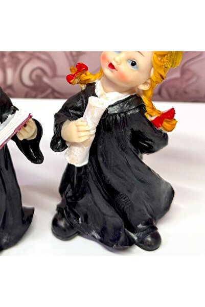 velve Set of two resin figurines, graduates with diploma and book, 18 cm