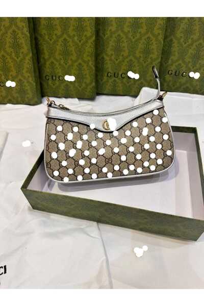 Güce Shoulder bag, an exact copy of the famous brand. It comes with a box, a bag, and a warranty card with the same brand name.