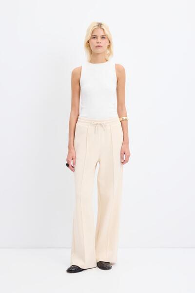 KADRİYE BAŞTÜRK High Waist Stitching Detail Relaxed Fit Trousers Cream