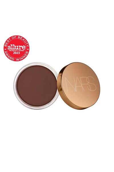 Nars BRONZING CREAM Kadifemsi yapılı Yumuşak, Mat Bitişlidir. Tene, Sıcaklık ...